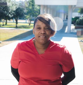 Phlebotomy student standing on campus